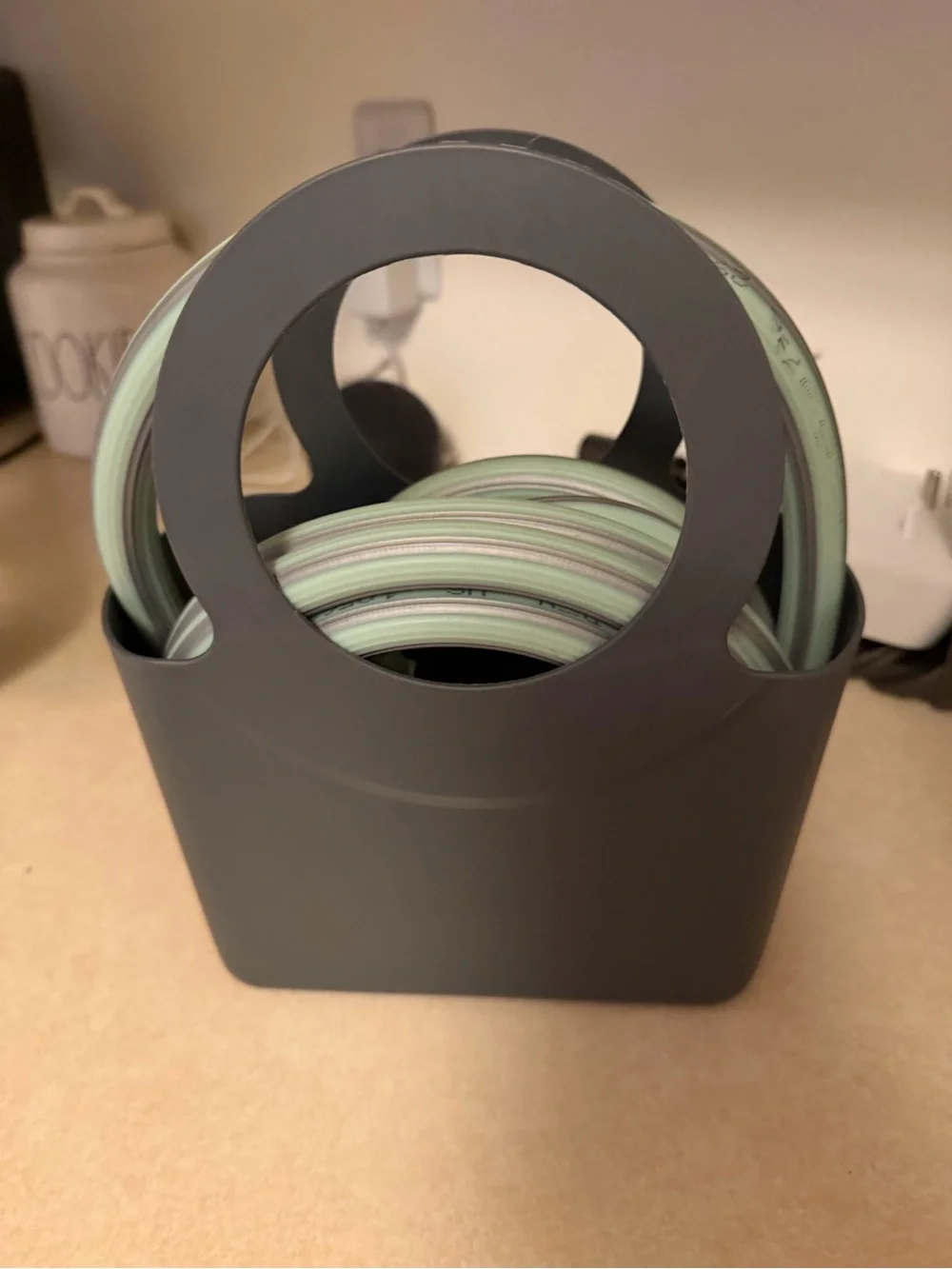 Gray Herb Garden Hose Caddy with Mint Green Hose